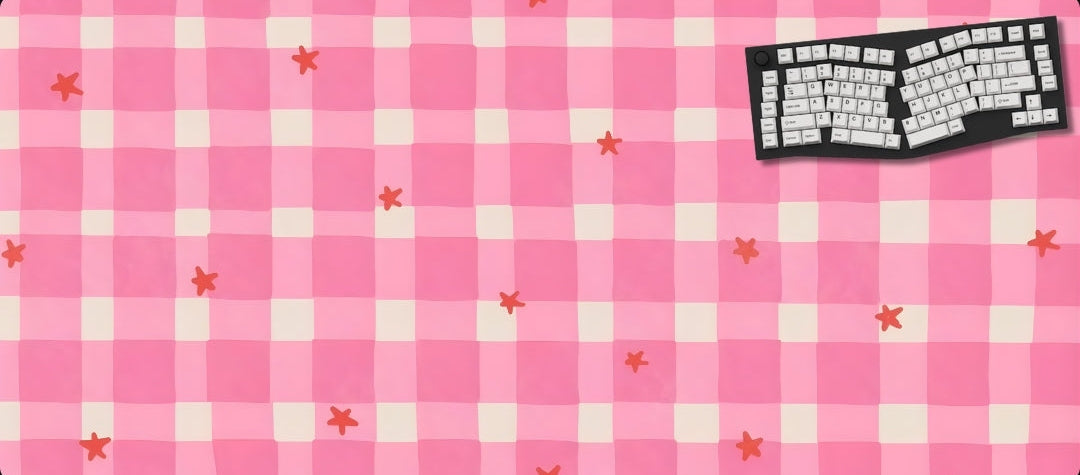 Pink checkered mouse pad with small red stars and a black and white keyboard graphic.