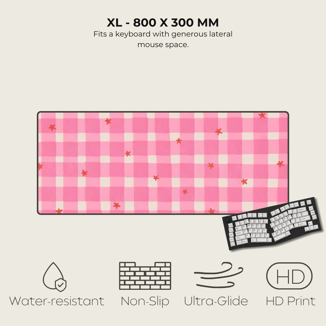 Pink checkered mouse pad with keyboard on a beige background