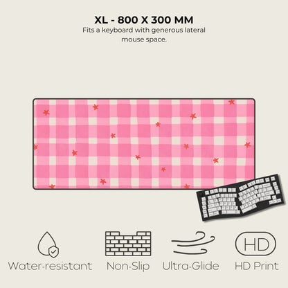 Pink checkered mouse pad with keyboard on a beige background