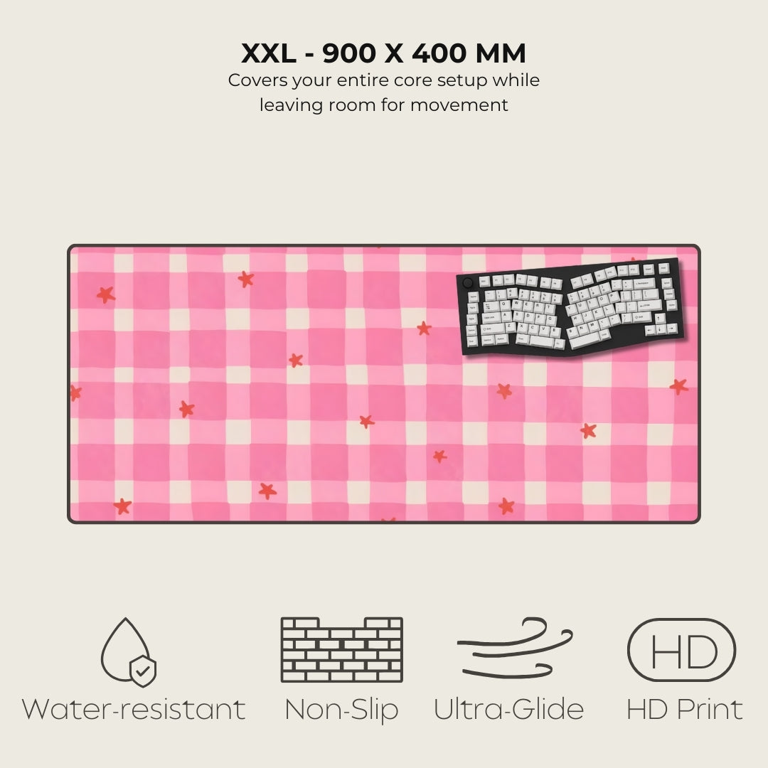 Pink checkered mouse pad with keyboard graphic on a light gray background
