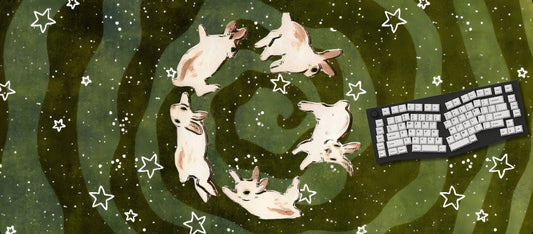 Feline-themed mouse pad with cats and a keyboard on a starry night design.