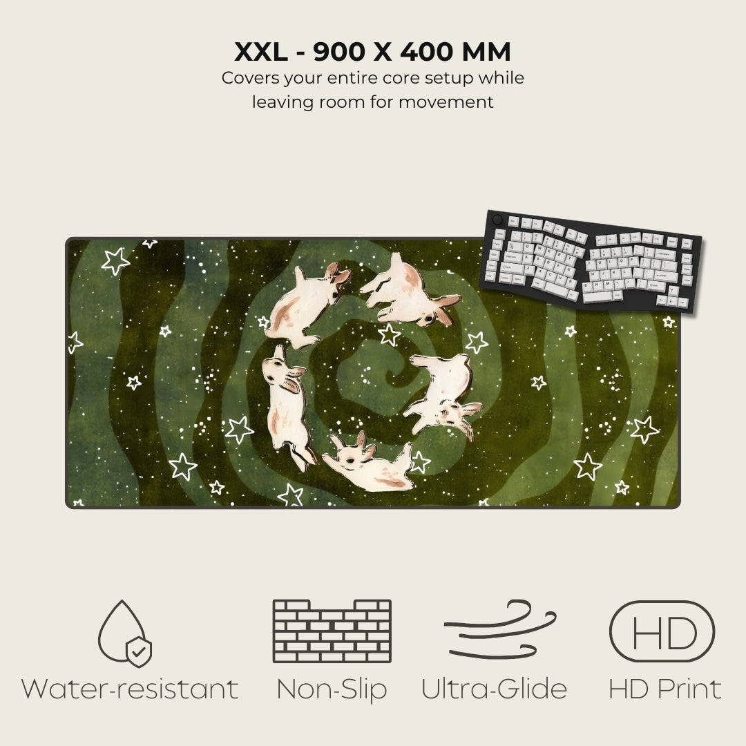 Large gaming mouse pad with starry night design and keyboard on a light gray background