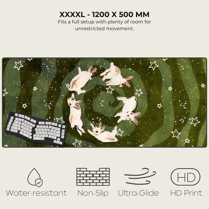 Large desk mat with cartoon dogs design, keyboard on it, and product features listed.