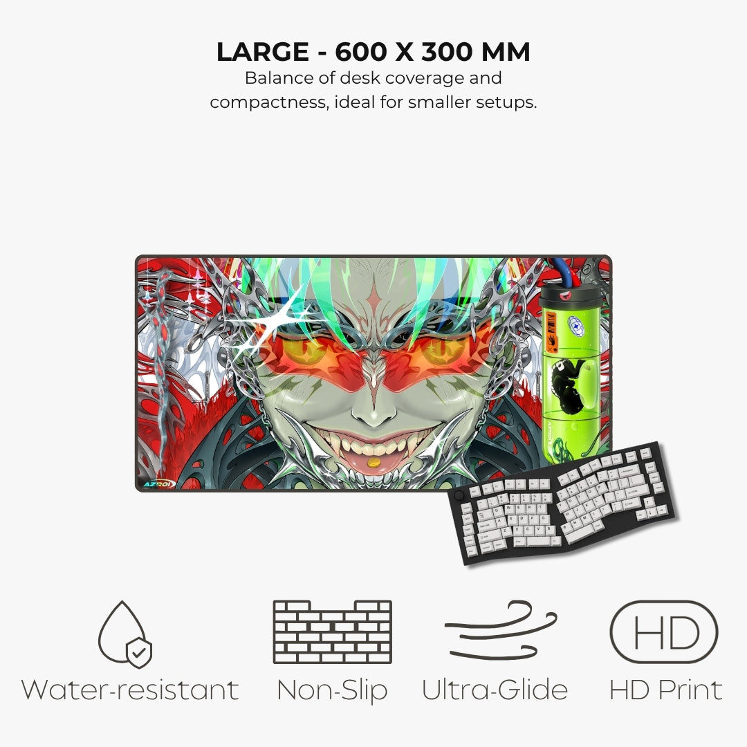 A large rectangular gaming desk mat with a colorful anime-style monster face design, shown on a light gray background with a keyboard illustration and feature icons for water resistance, non-slip, ultra-glide, and HD print. Text at the top reads 'LARGE - 600 X 300 MM'.