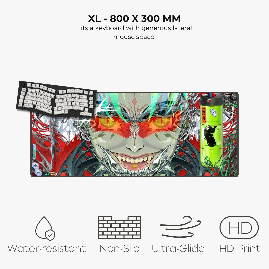 A large rectangular gaming desk mat with a colorful illustrated anime-style face and red mechanical keyboard keys printed on it, shown on a light gray background with text reading 'XL - 800 X 300 MM' and feature icons for water-resistant, non-slip, ultra-glide, and HD print.