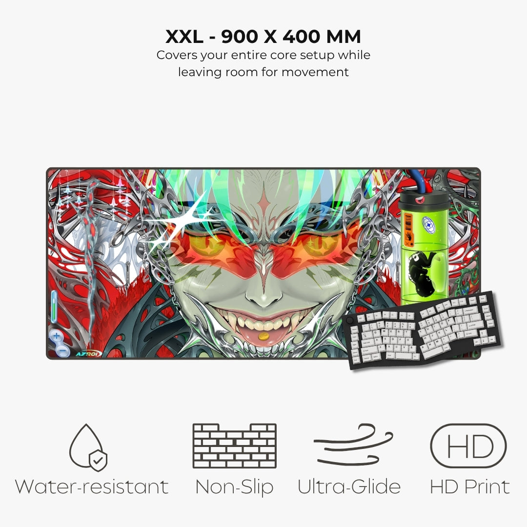 A large XXL gaming desk mat with a colorful anime-style character design, shown with a keyboard and mouse pad on a light gray background. Text at the top reads 'XXL - 900 X 400 MM' and lists features like water-resistant, non-slip, ultra-glide, and HD print.