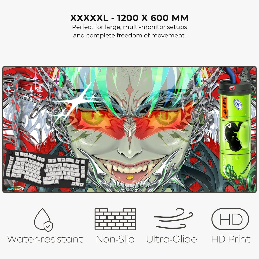 A large gaming desk mat with a colorful anime-style monster face design, shown on a light gray background with feature text and icons for water resistance, non-slip, ultra-glide, and HD print.