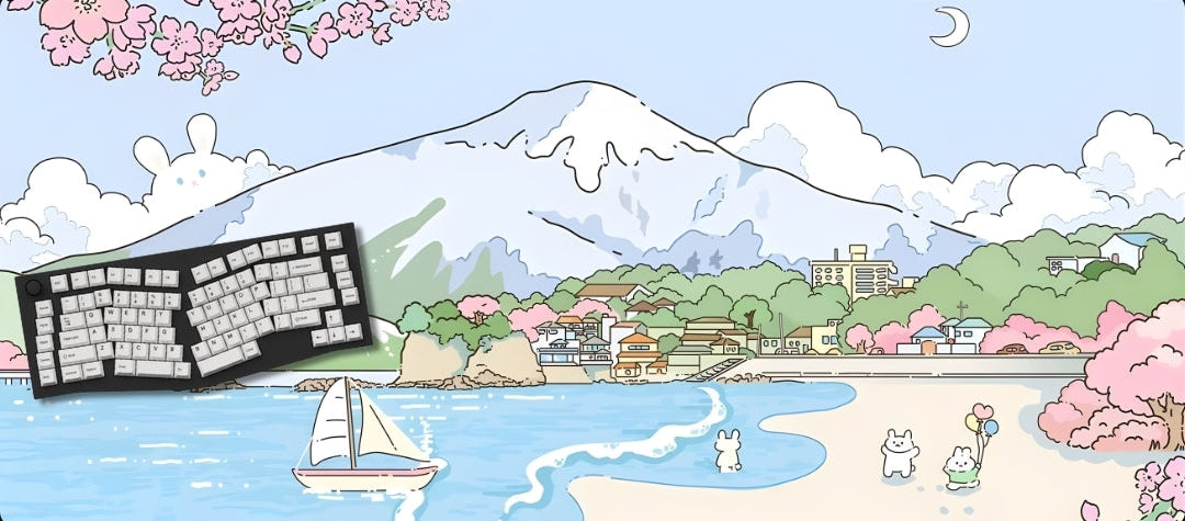 Keyboard with a scenic beach and mountain background