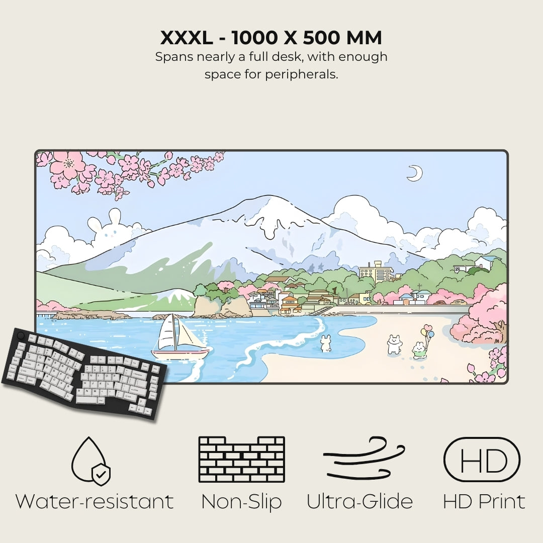 Large desk mat with a scenic design, keyboard, and product features on a beige background