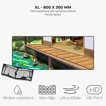 An XL keyboard mouse pad shown on a light gray background with text reading 'XL - 800 X 300 MM' and feature icons for water resistance, non-slip, ultra-glide, and HD print. The pad displays a pixel-art style wooden dock and garden scene, with a small inset showing the pad laid over a keyboard.