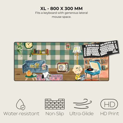 Large mouse pad with a colorful design of a living room scene, featuring a keyboard on top.