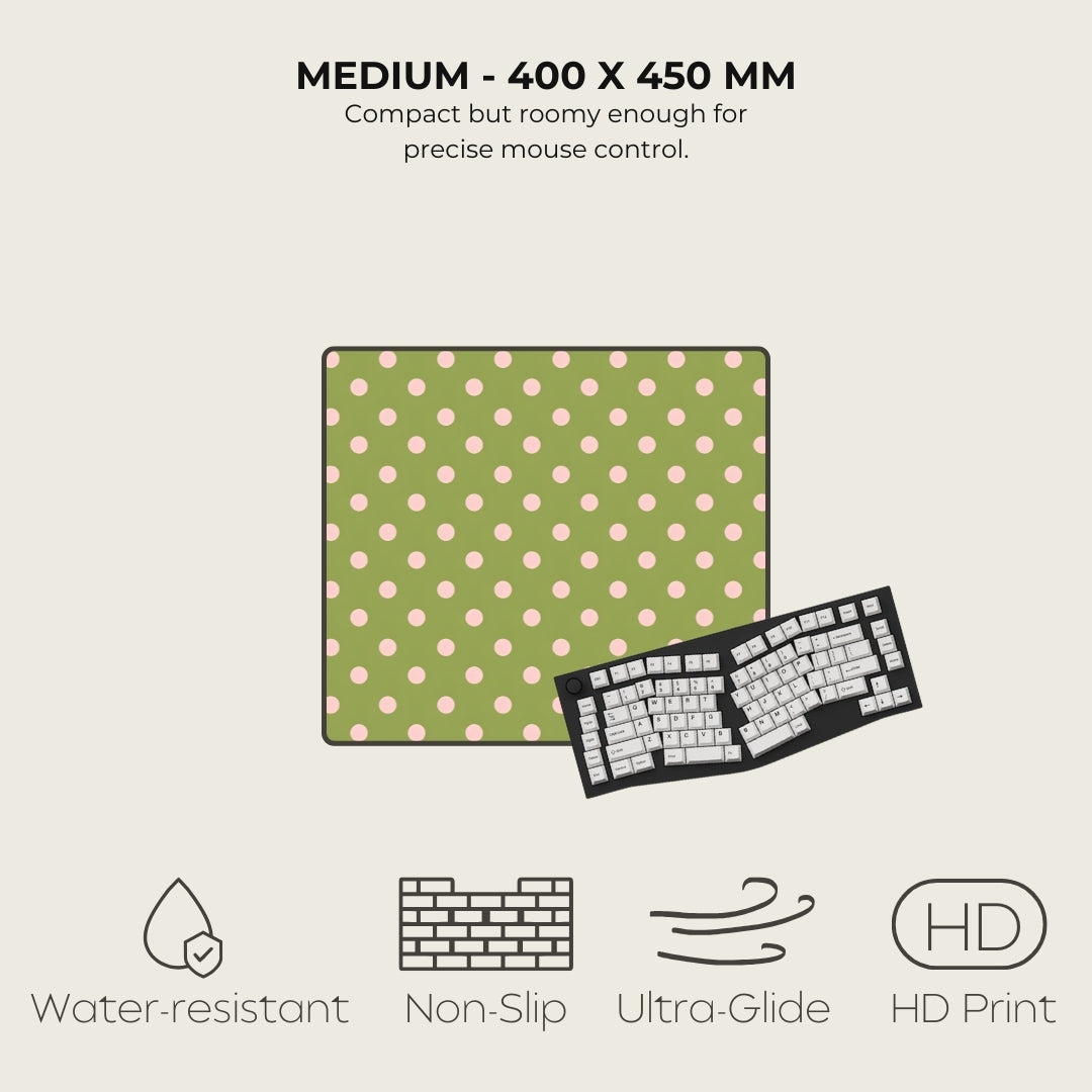 Green mouse pad with pink dots and a keyboard on a light gray background, featuring text and icons about product specifications.