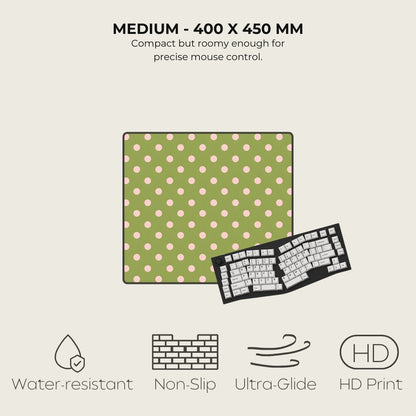 Green mouse pad with pink dots and a keyboard on a light gray background, featuring text and icons about product specifications.