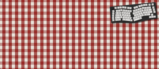 Red and white checkered tablecloth with a keyboard on a black background