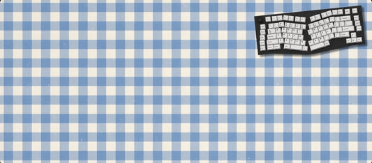 Blue and white checkered mouse pad with a keyboard graphic on a black background