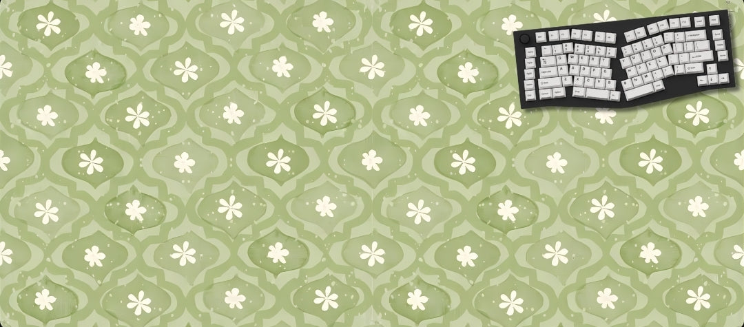 Green floral patterned mouse pad with a keyboard graphic on a black background