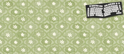 Green floral patterned mouse pad with a keyboard graphic on a black background