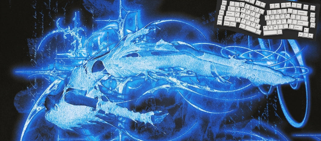 A rectangular desk mat or mouse pad with a glowing blue digital graphic of a stylized creature on a black background, shown with a small inset of a white keyboard placed in the upper right.