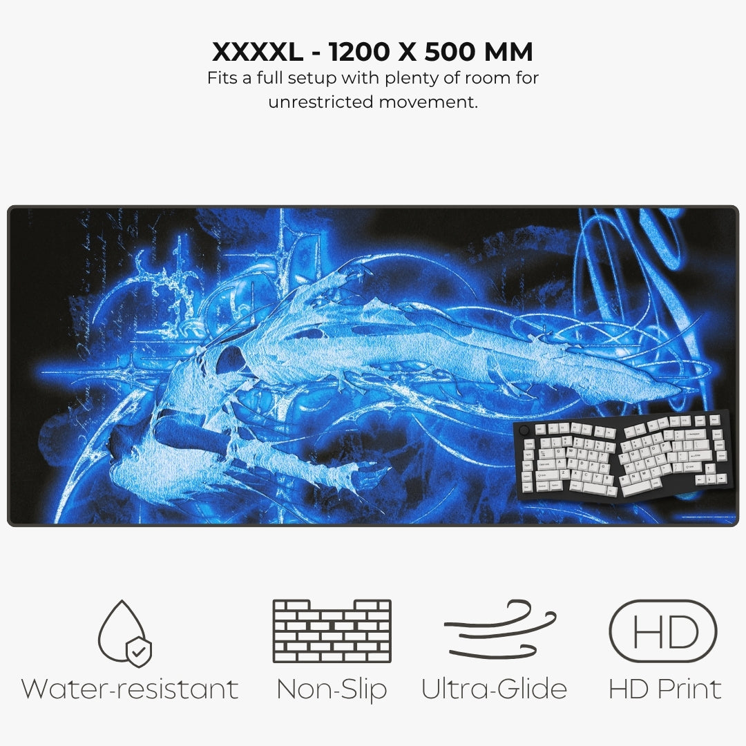 Listing for a large XXXXL size gaming desk mat with a blue and black abstract graphic design, shown on a light gray background with text detailing its 1200 x 500 mm size and features like water resistance, non-slip, ultra-glide, and HD print.