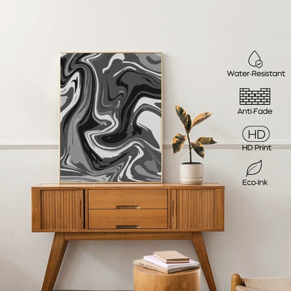 Wooden console table with a marble-patterned art print and a plant on a white wall.