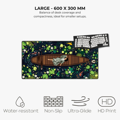 A large desk mat featuring an illustrated pond scene with lily pads, koi fish, and a person rowing a boat, shown on a light gray background with text reading 'LARGE - 600 X 300 MM' and feature icons for water resistance, non-slip, ultra-glide, and HD print.