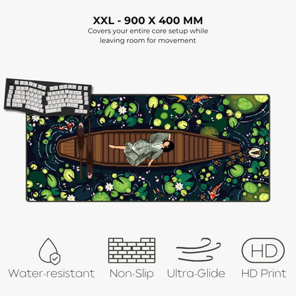 An XXL size yoga mat featuring a detailed art print of a woman in a wooden boat surrounded by lily pads on a dark water background. The mat is displayed on a light gray background with text detailing its dimensions and features like water resistance, non-slip texture, and high-definition print.