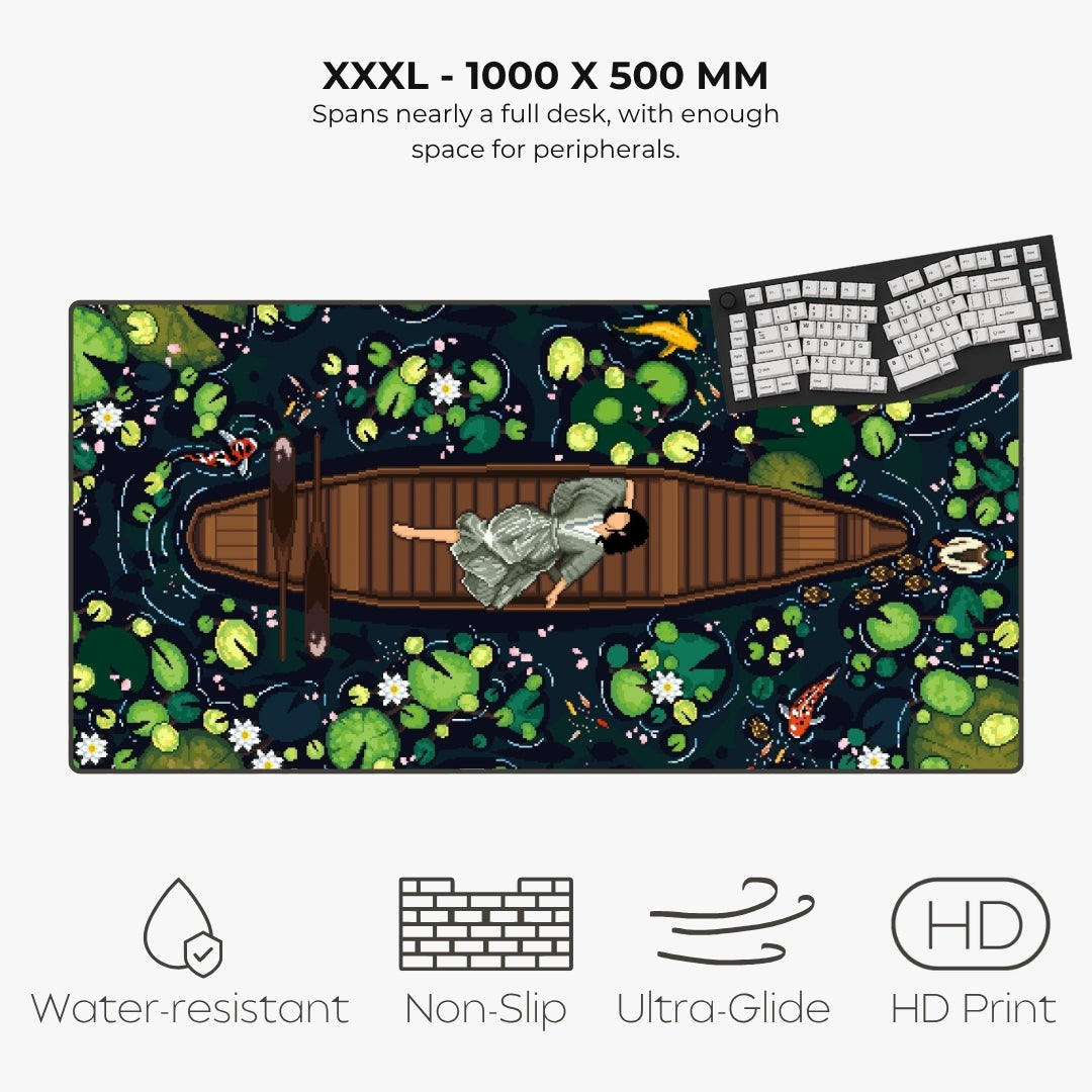 A large desk mat with a detailed water-lily pond illustration, shown on a light gray background with text indicating dimensions (XXXL - 1000 x 500 mm) and feature icons for water resistance, non-slip, ultra-glide, and HD print.
