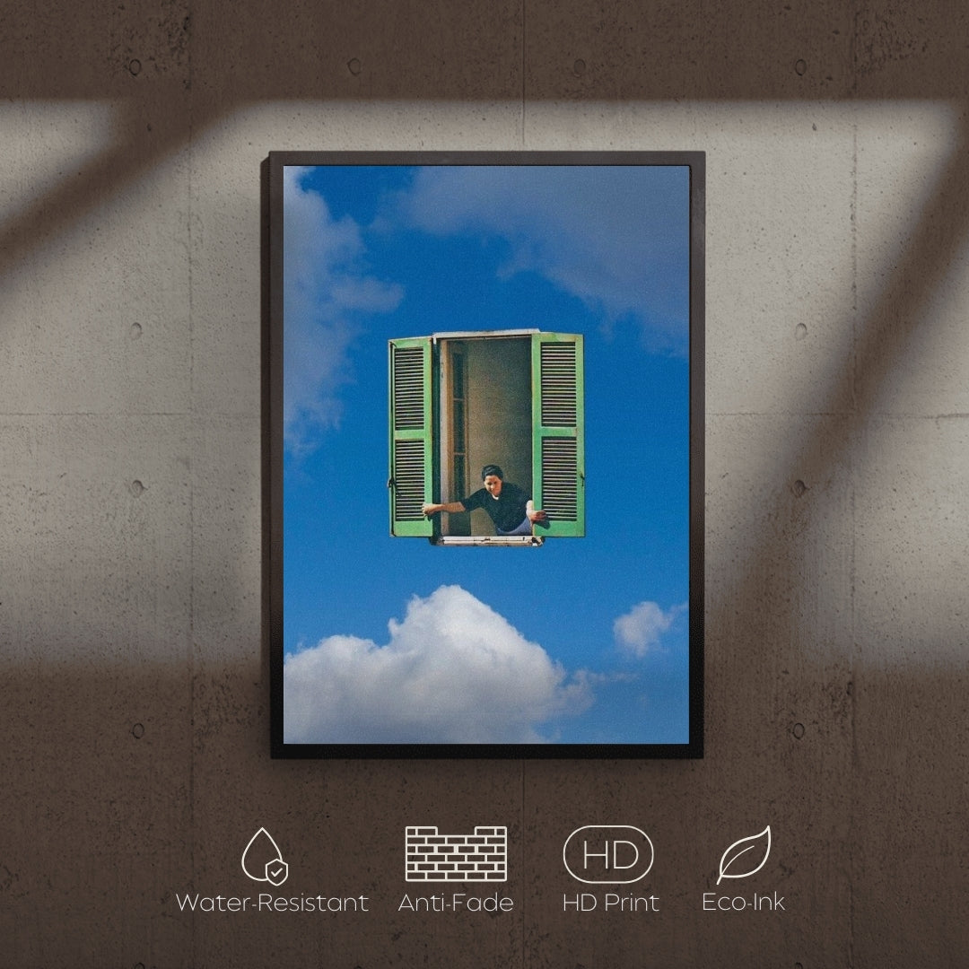 Framed artwork of a person sitting on a cloud with a green window, displayed on a textured wall.