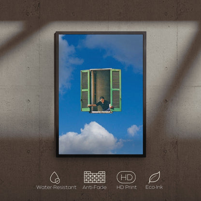 Framed artwork of a person sitting on a cloud with a green window, displayed on a textured wall.