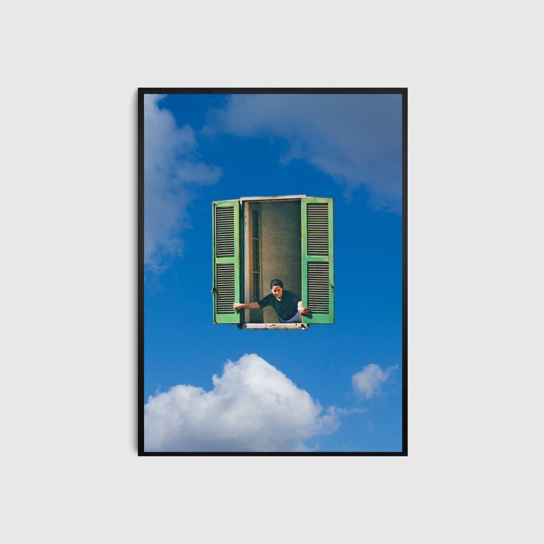 Framed artwork of a person sitting inside a green window with a blue sky and clouds in the background.