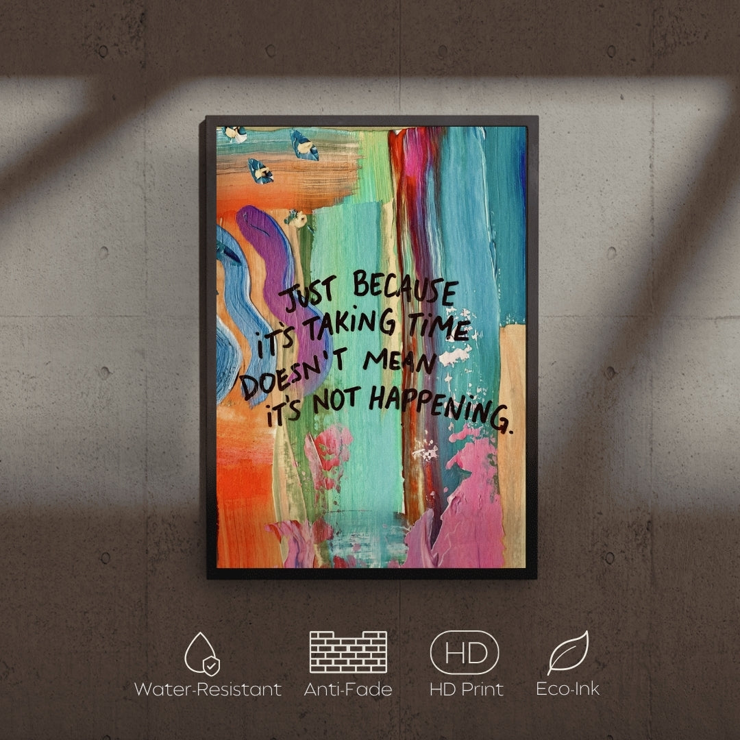 Colorful abstract art print with motivational quote on a textured wall.