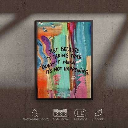 Colorful abstract art print with motivational quote on a textured wall.