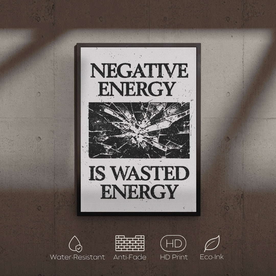 Framed poster with 'Negative Energy is Wasted Energy' text on a textured wall.