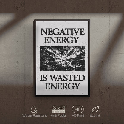 Framed poster with 'Negative Energy is Wasted Energy' text on a textured wall.