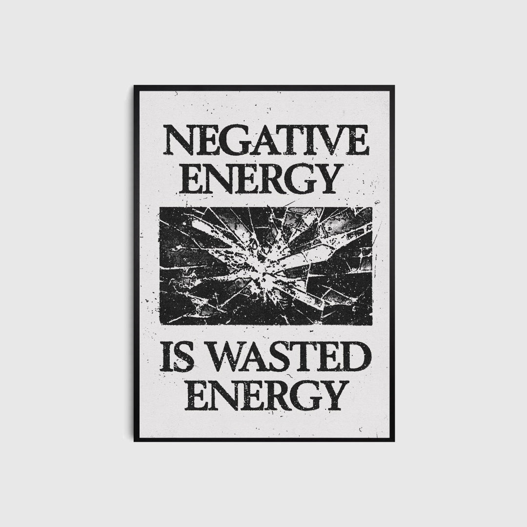 Framed poster with 'Negative energy is wasted energy' text on a light gray background