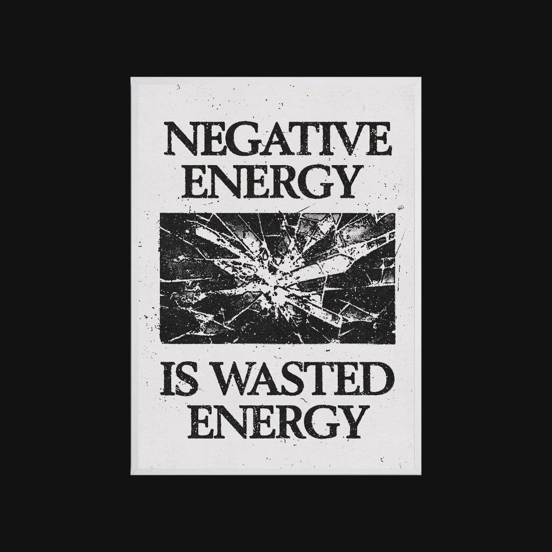 Motivational poster with 'Negative energy is wasted energy' text and a shattered glass graphic on a white background.