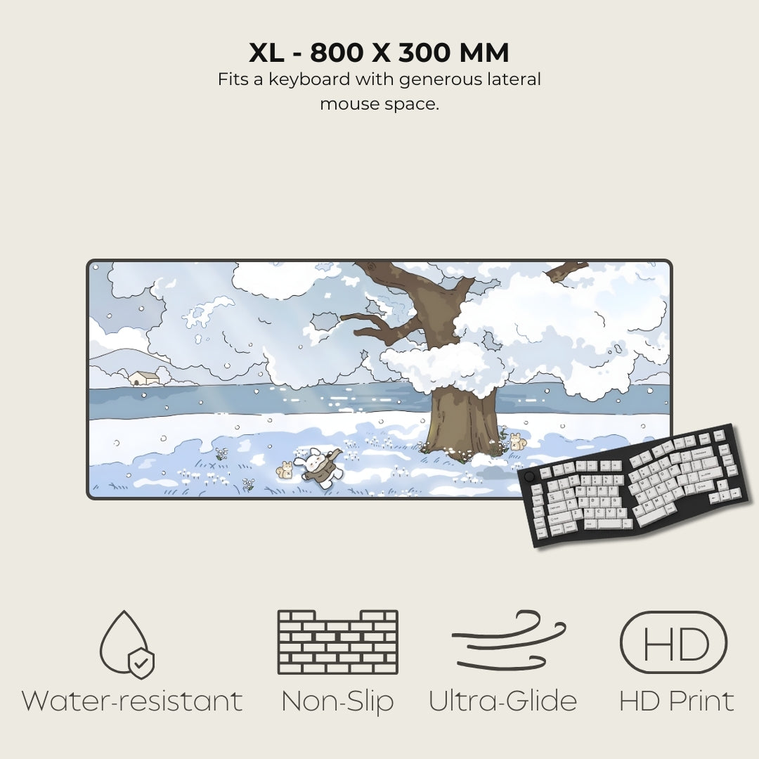 Large mouse pad with winter landscape design, keyboard on the side, and product features listed.