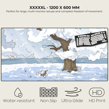 Large desk mat with winter scene design featuring a tree and keyboard, labeled XXXXL - 1200 x 600 MM.