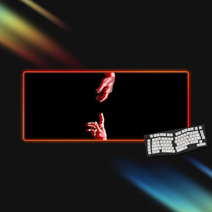 RGB mousepad with a red and black design, keyboard on a dark background